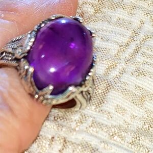 An amethyst  beautiful  adorned in lots of sterling size 6